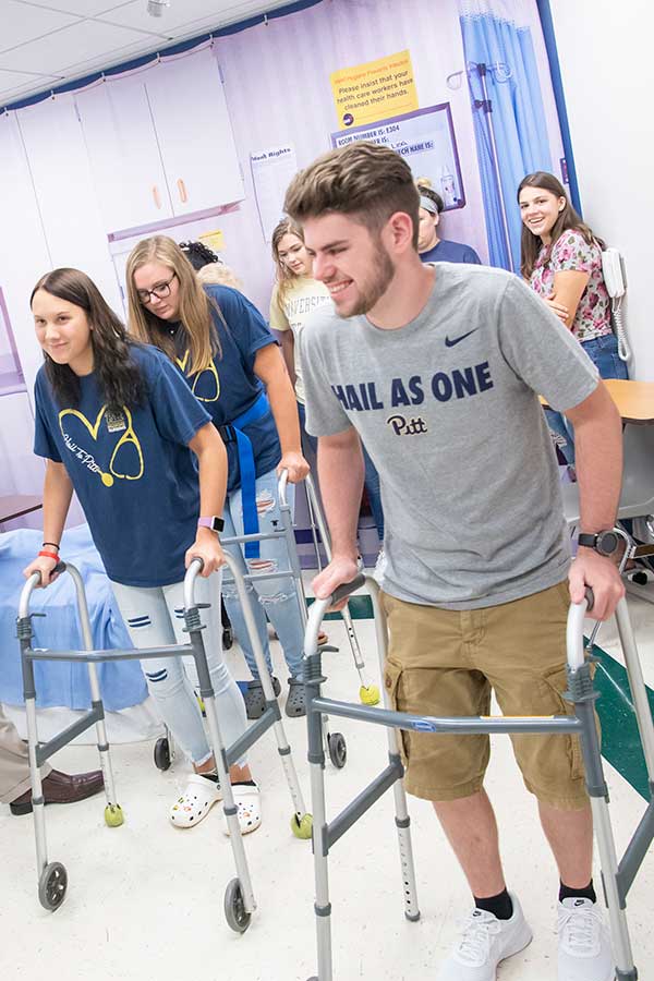 Nursing students on walkers