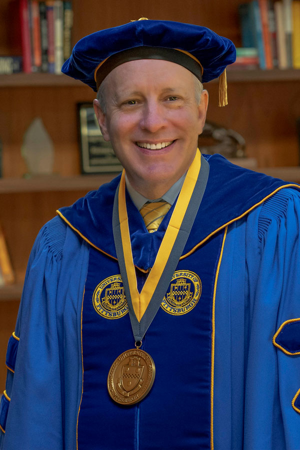 Prersident Esch wearing regalia