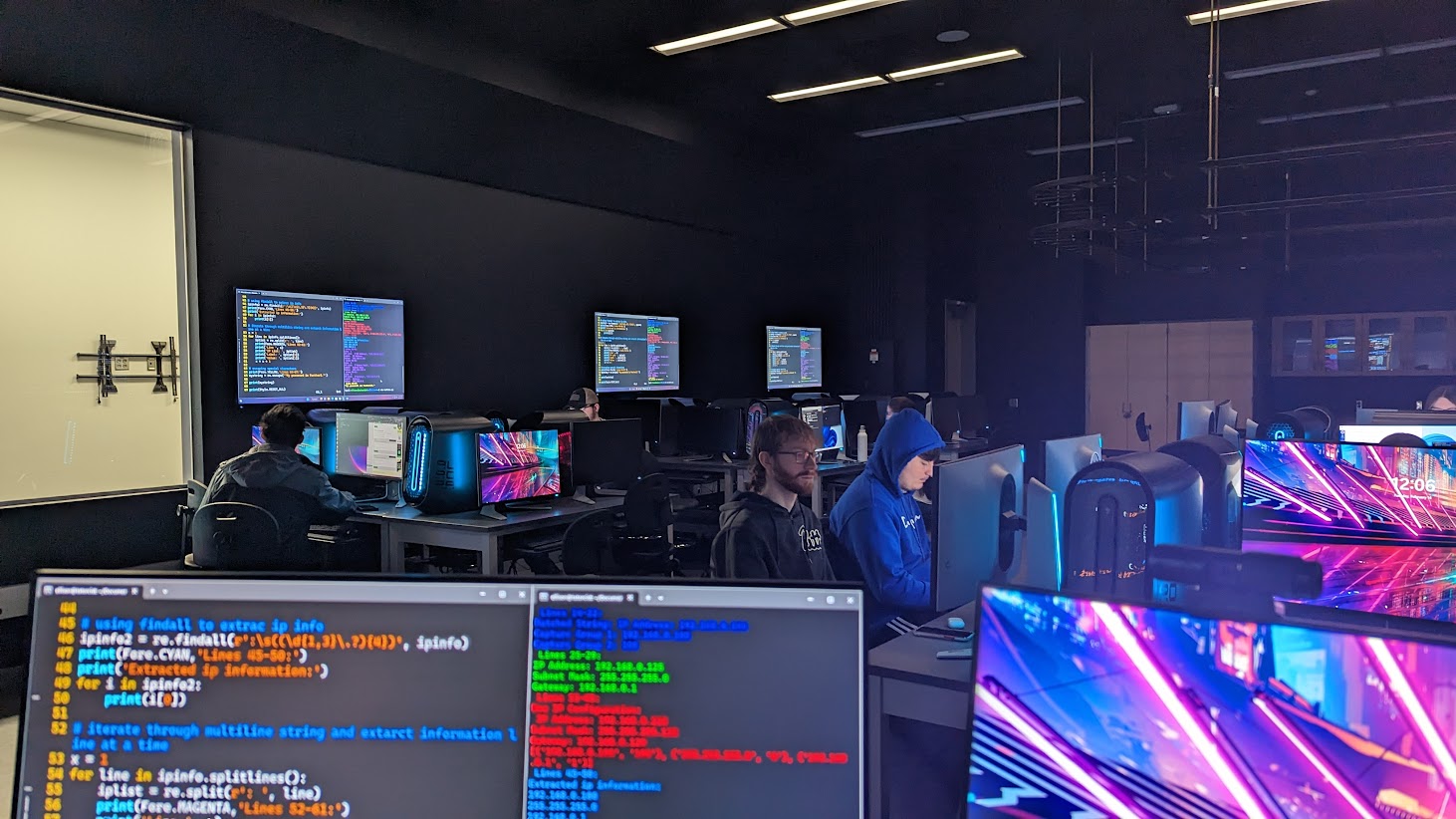 Computers with code on screens