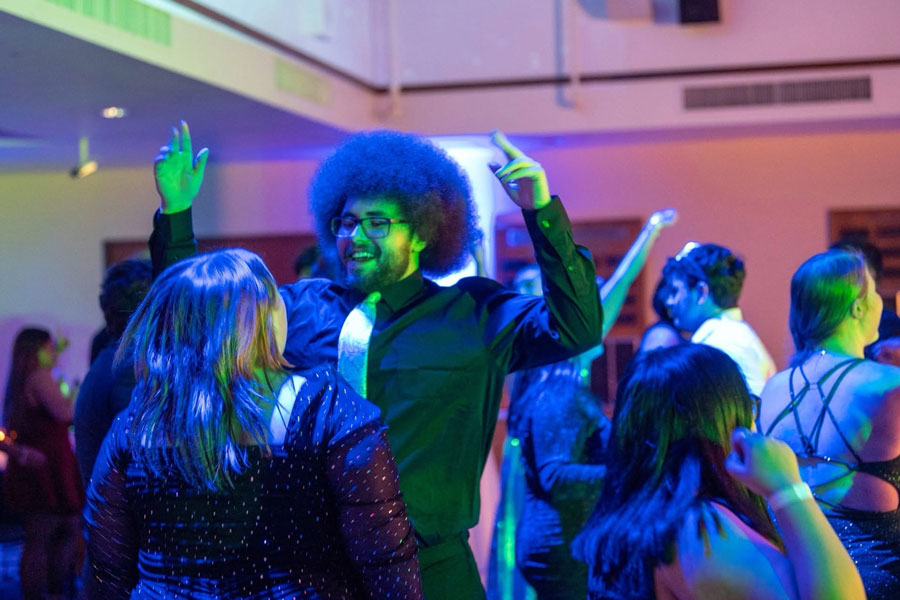 People dancing and having fun at the formal.