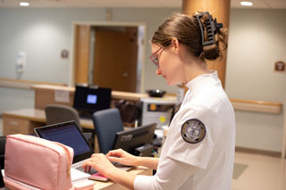 Nursing student working at computer