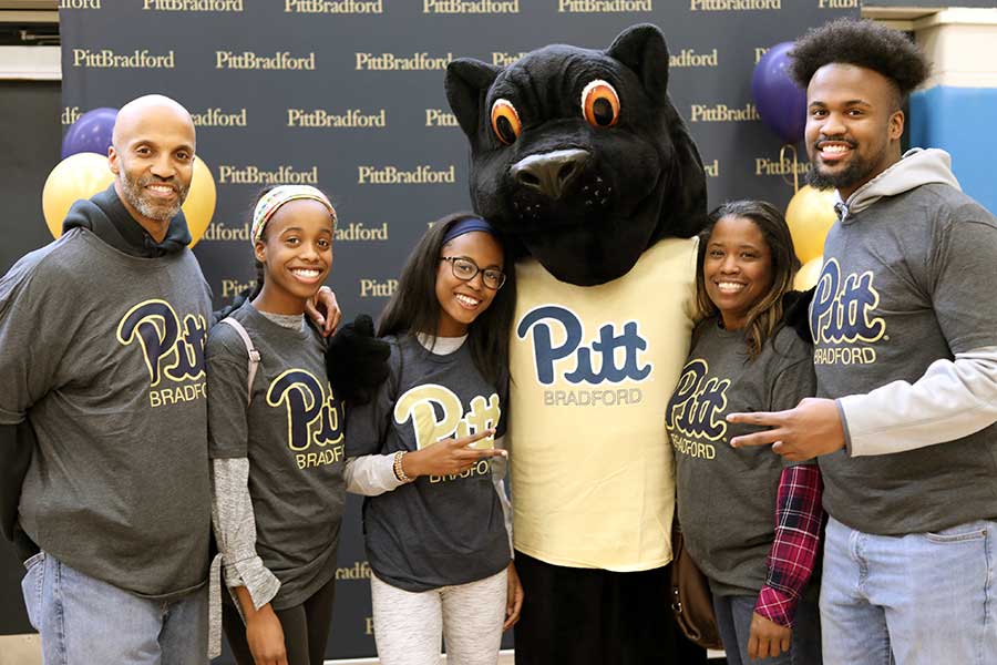 Family and student with panther