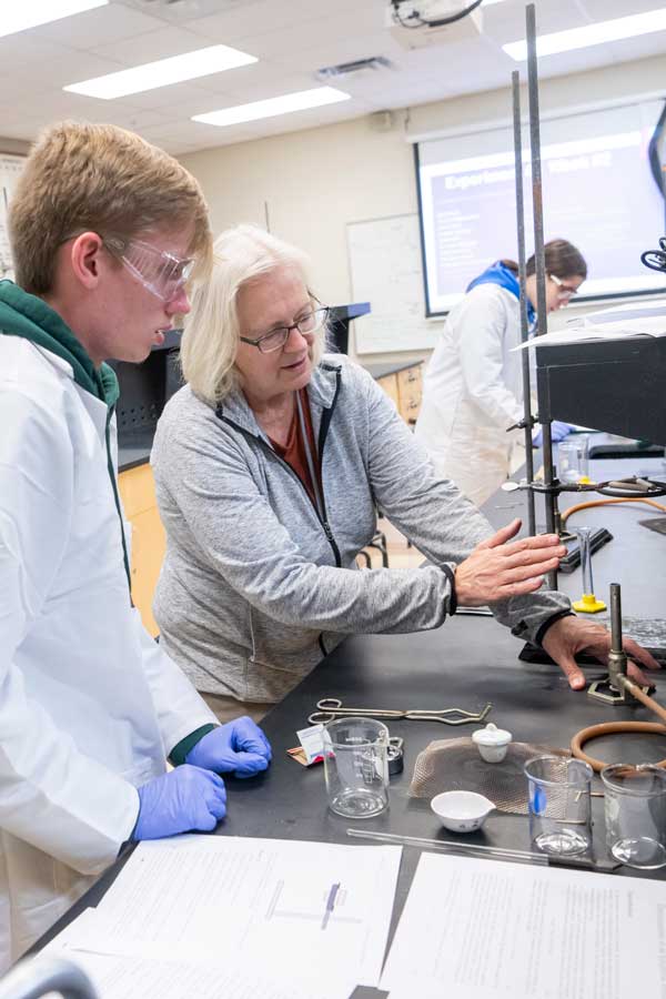 Chemistry professor at whiteboard