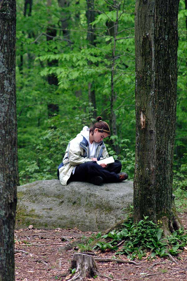 Girl sitting on rock