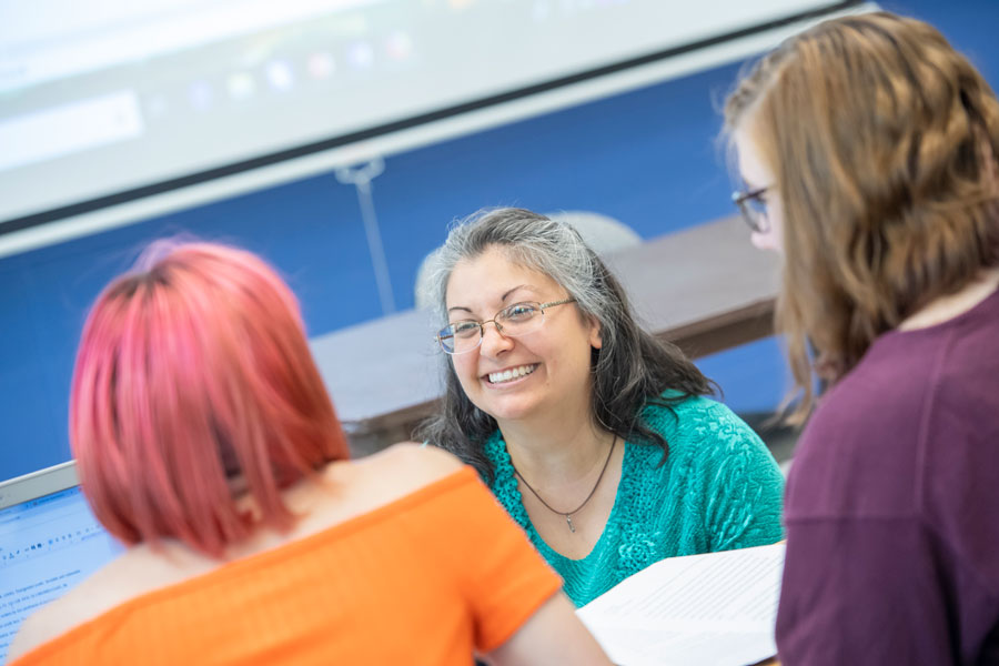 Professor with two students