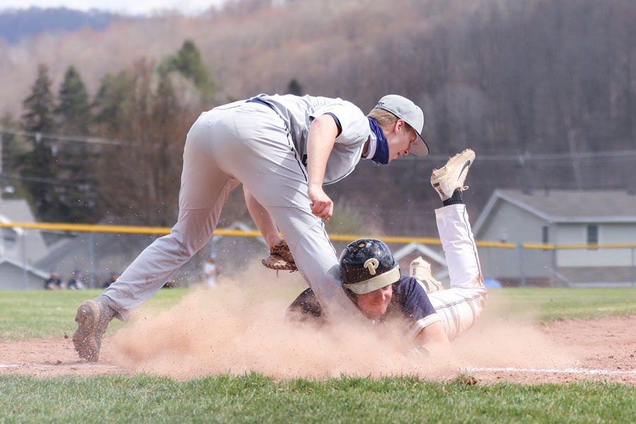 Baseball player sliding into base