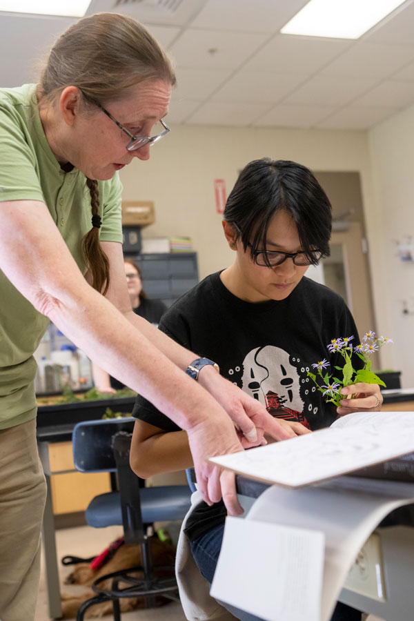 Student and professor identifying flower