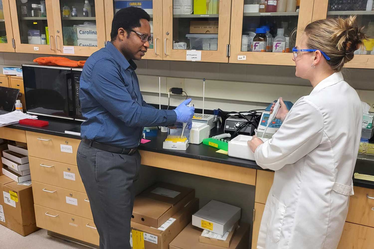 Dr. Lanre with student researcher