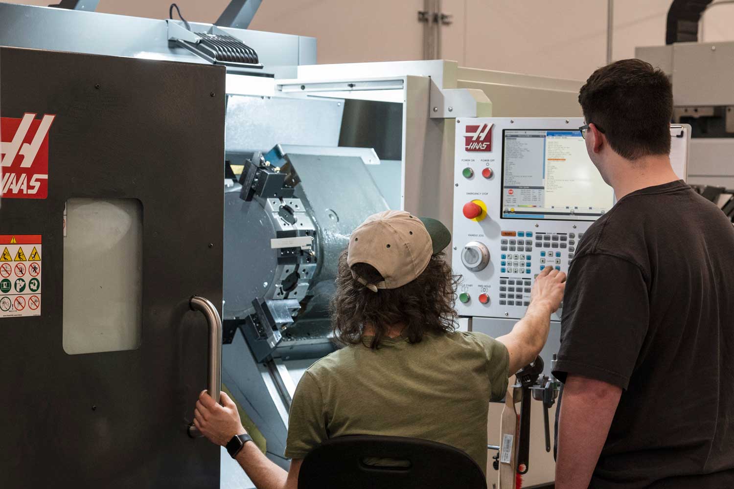 Students operating lathe