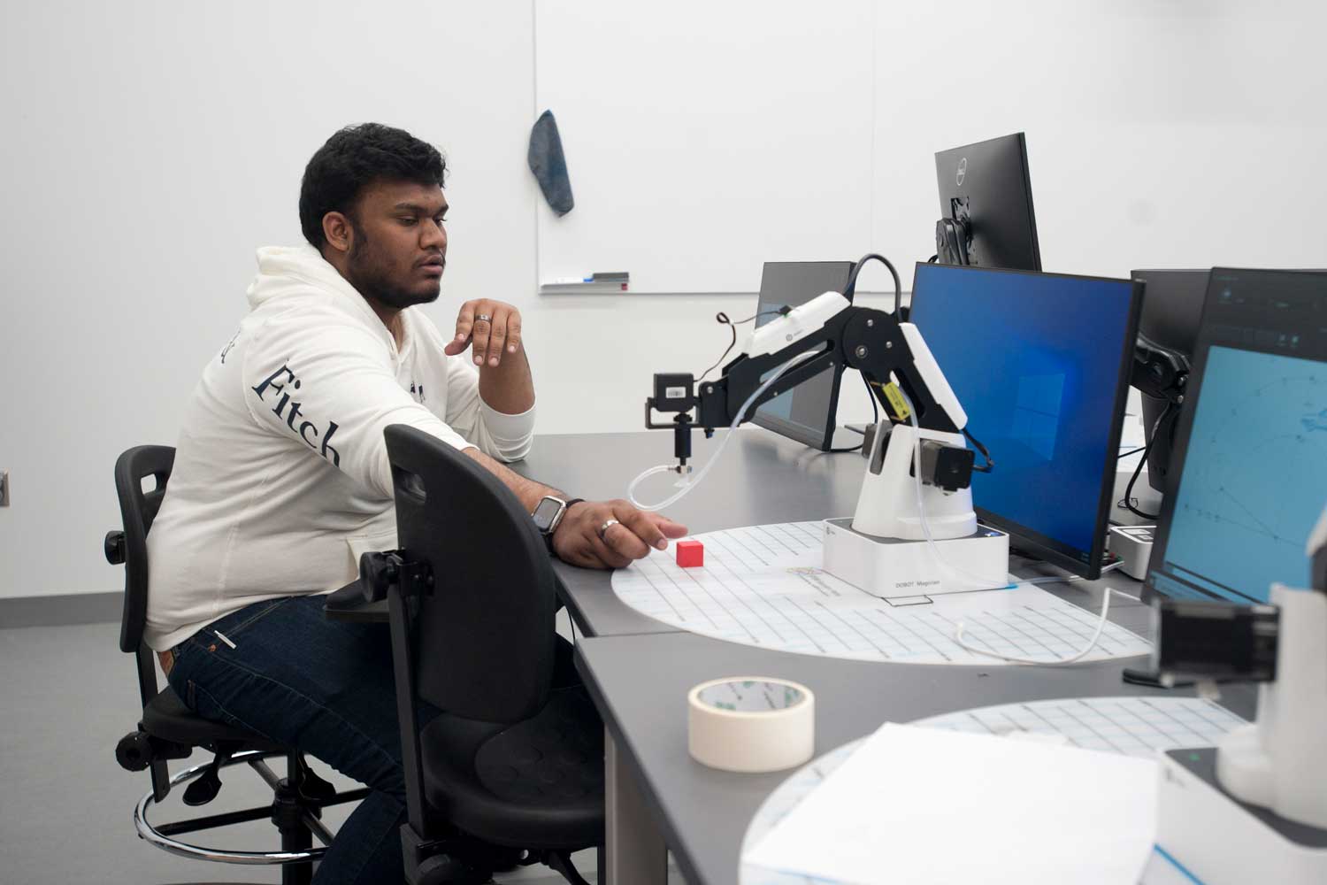 Student using robot arm