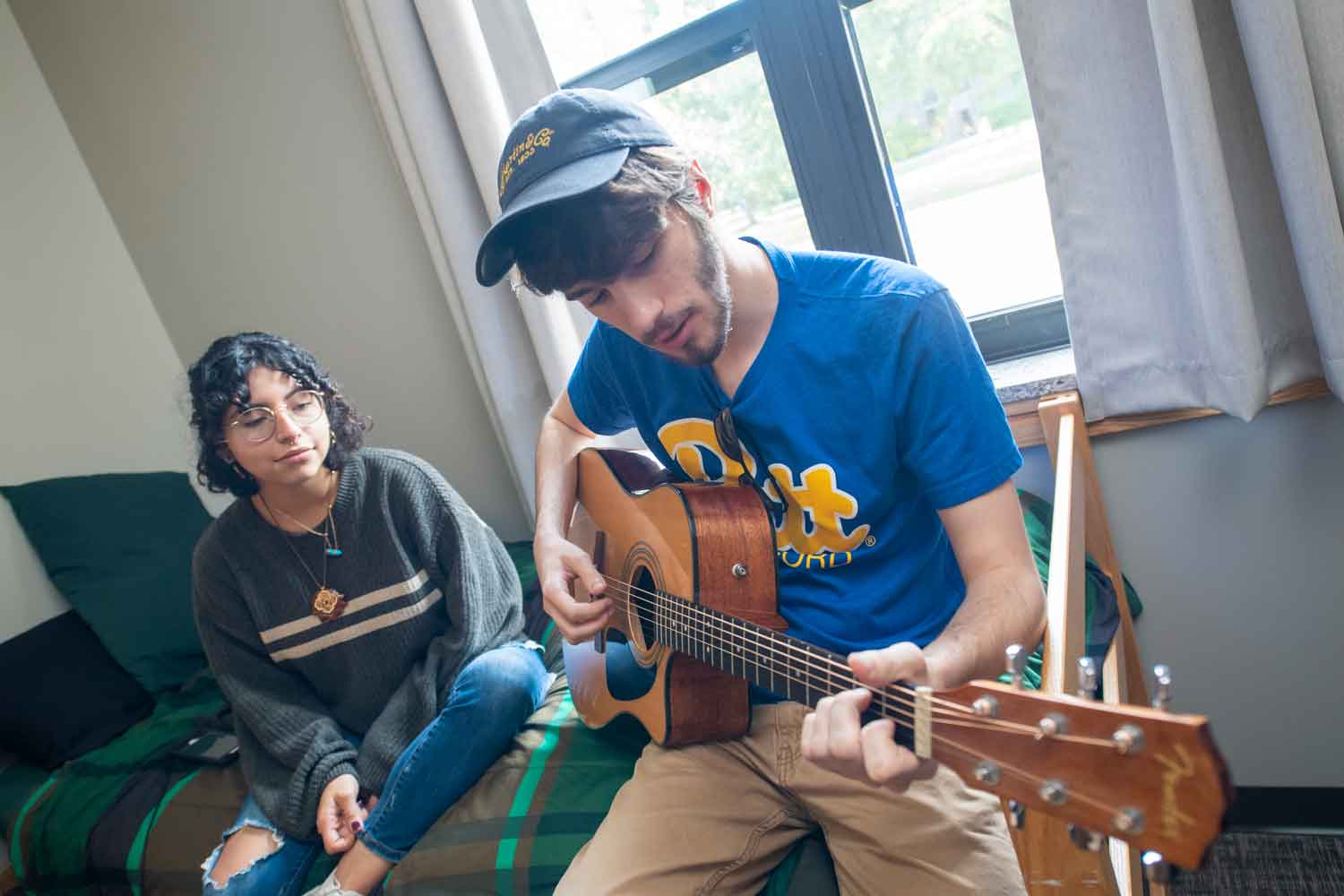 Students playing guitar