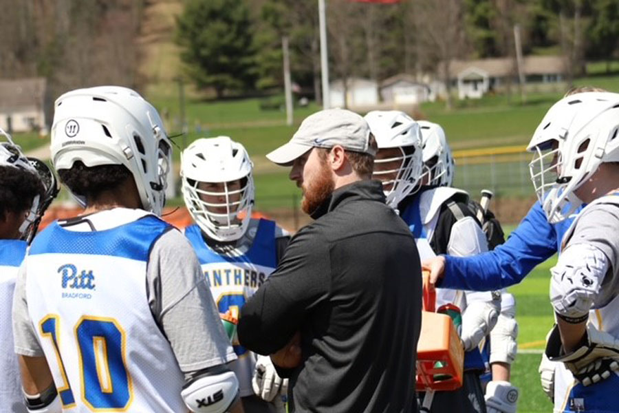 Lacrosse players and coach
