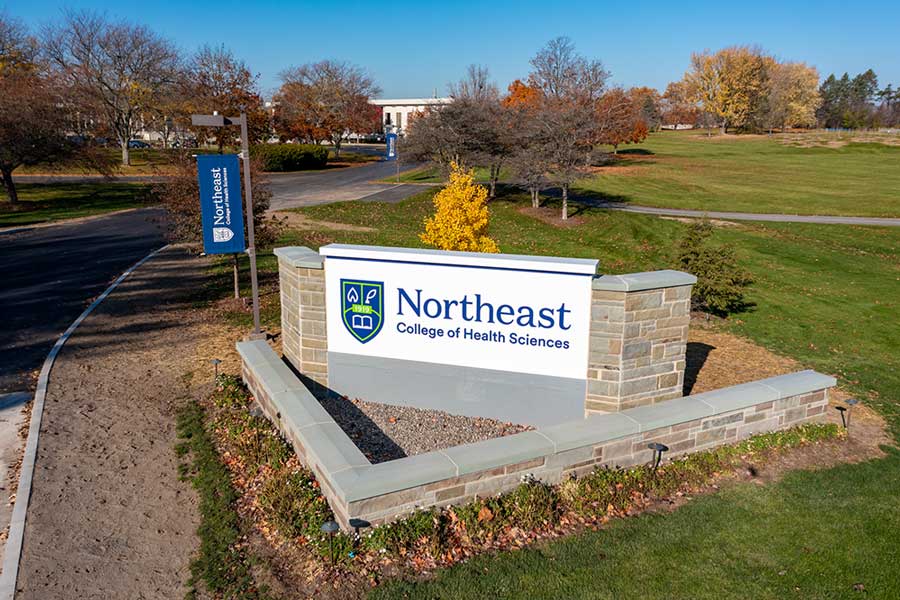The entrance with a sign that says Northeast College of Health Sciences