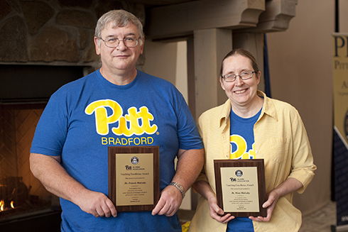 Drs. Francis and Mary Mulcahy posing with teaching awards