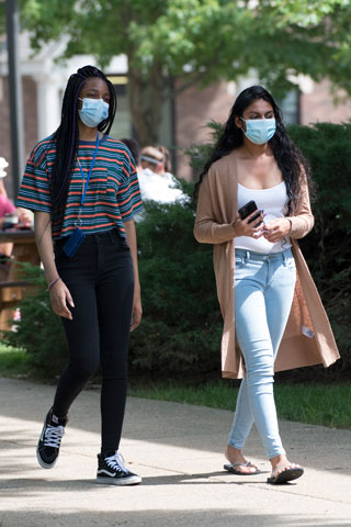 Students walking with masks on