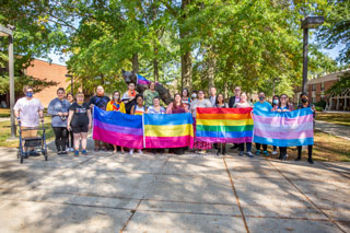 Kids with Gay Pride Flags