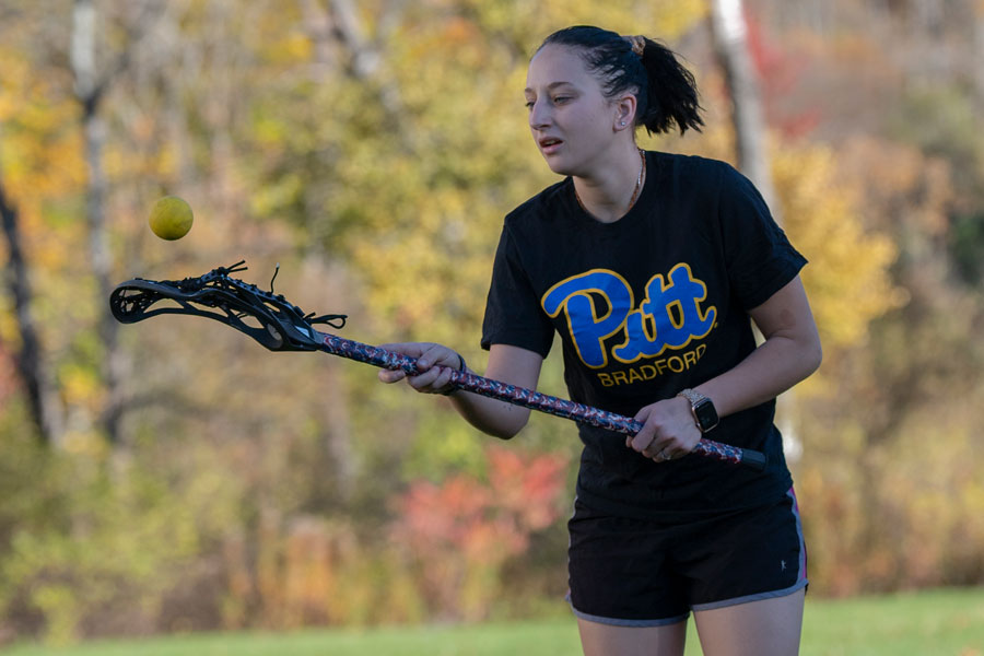 Student playing lacrosse