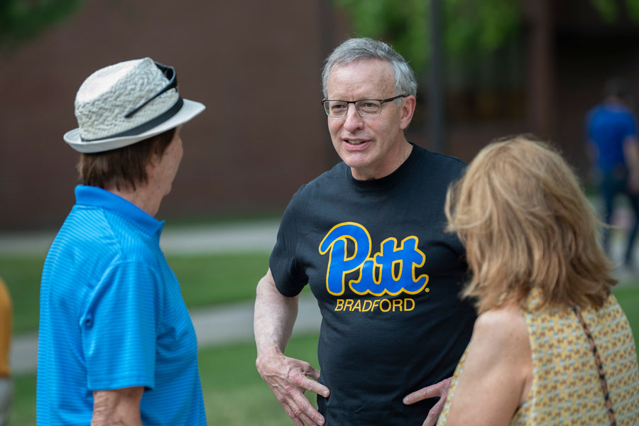 President Rick Esch speaking with faculty