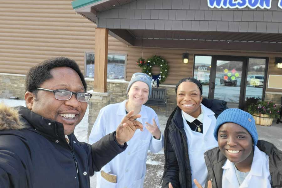 Dr. Lanre with students