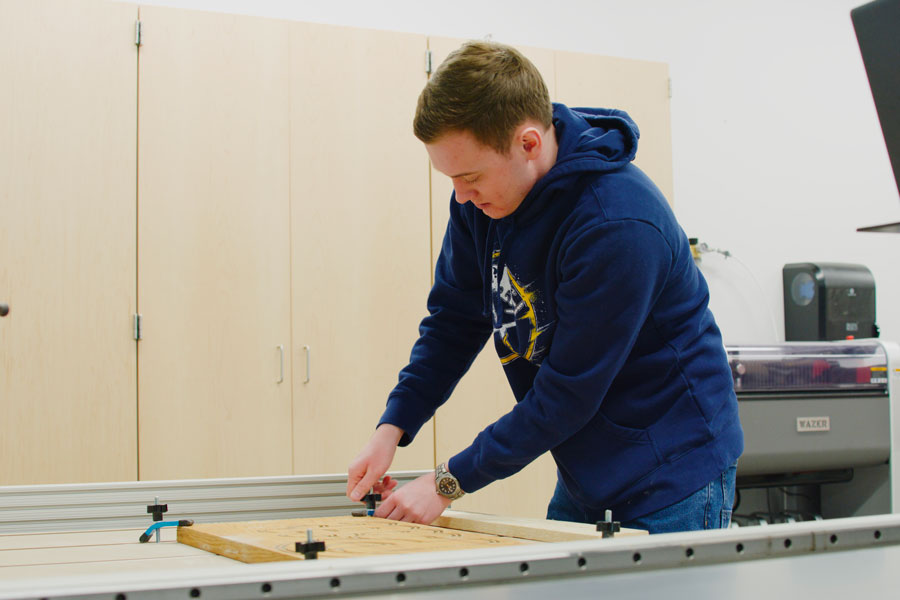 Mychal Berlinski working in the makerspace