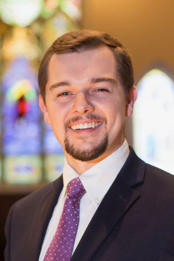 A portrait of Mitchell Stecker, an organist