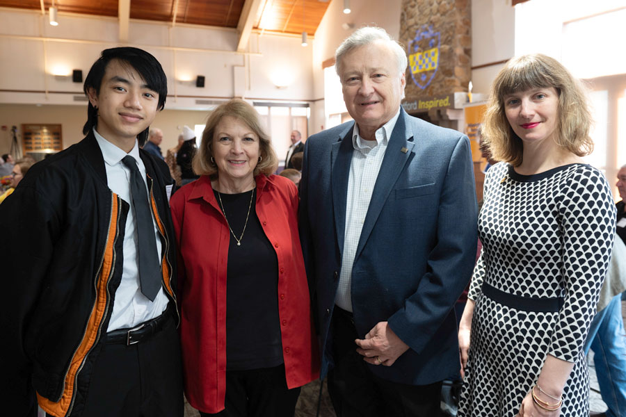 Business management major Vince Vang with Cindy and John Jarzab and Christine Jarzab Kuntz