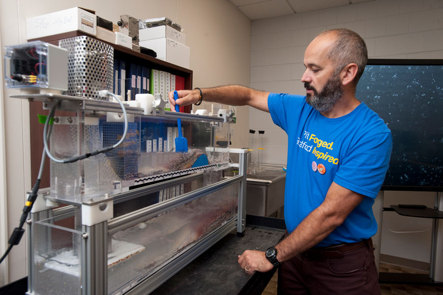 Dr. Ovidiu Frantescu working with sand and water