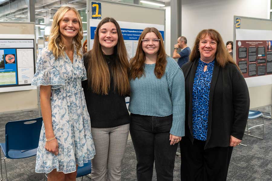 Nursing students with instructor smiling for picture