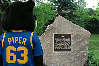 Panther mascot wearing a Pitt jersey with its new name Piper on the back.