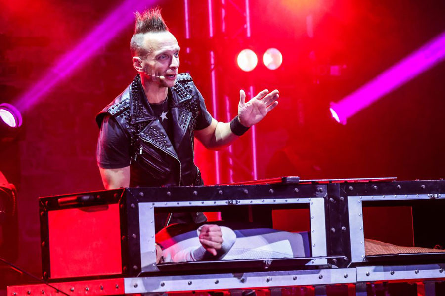 Illusionist Leon Etienne performing magic for "Magic Rocks"