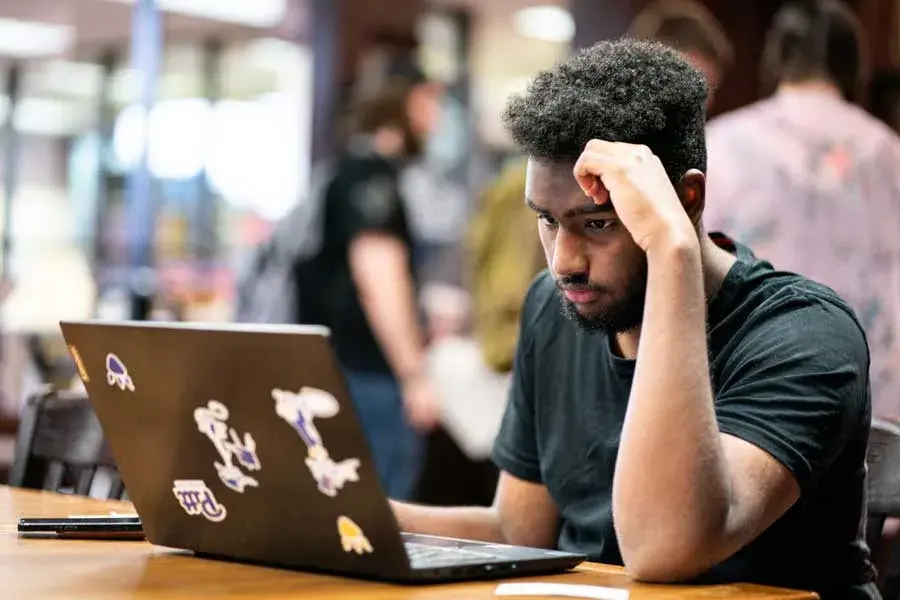 Student using laptop in the library