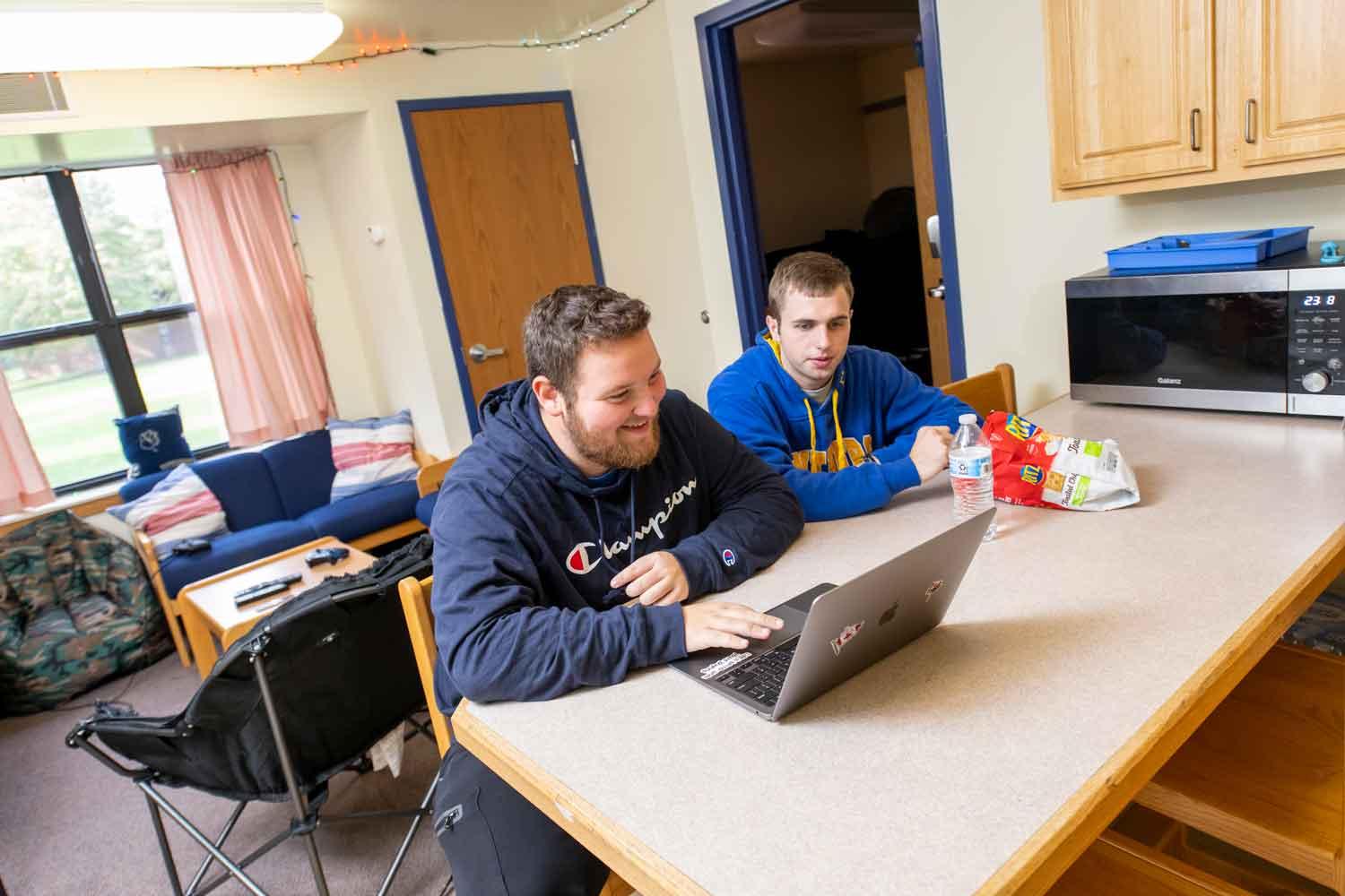 Guys studying in suites