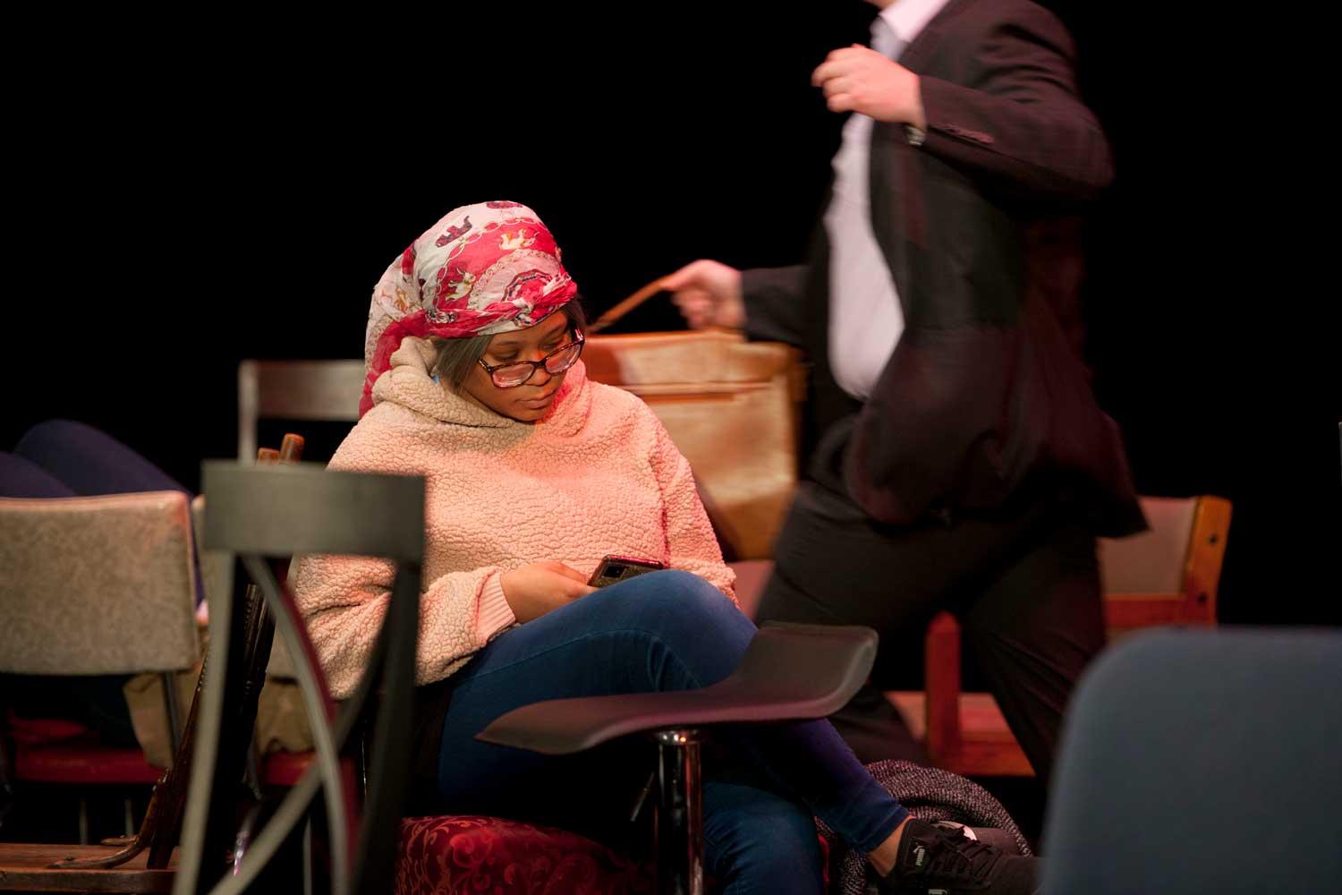 	Student wearing headband sitting in chair