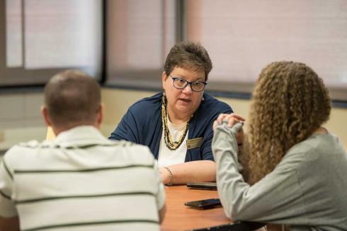 Advisor with students