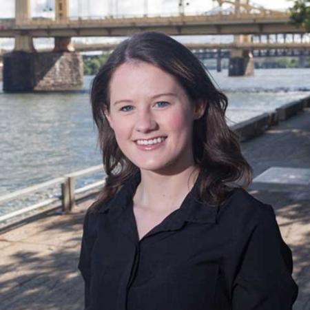 Delaney Held in front of bridge