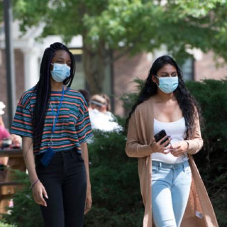 Students walking with masks on