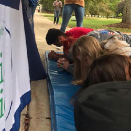 Students performing planking challenge