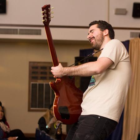 Staff playing guitar