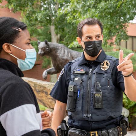 Oficer directing a student