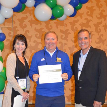 Dr. Mark Kelley receiving award.