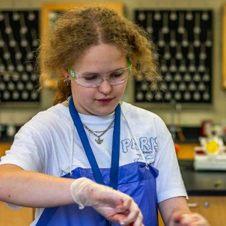 Student experimenting with blood splatters
