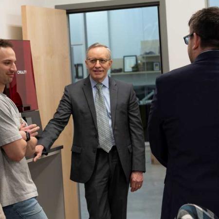 President Esch and others in the makerspace