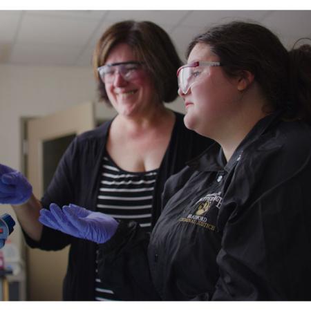 Dr. Robin Choo with a student