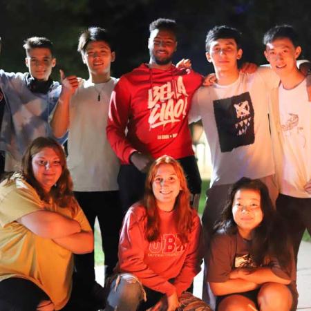Students hanging out at a cookout