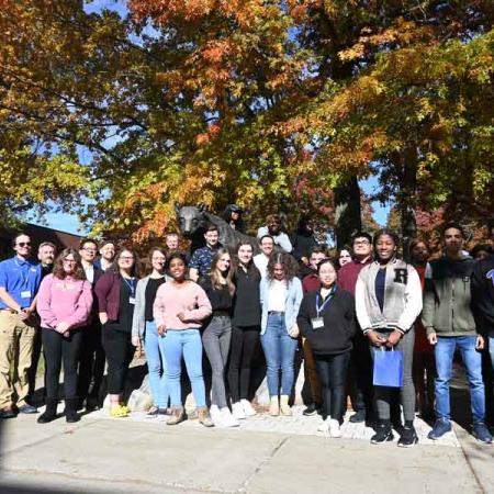 Students around the panther who participated in entrepreneurial event
