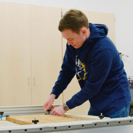 Mychal Berlinski working in the makerspace