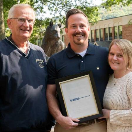 Don Lewicki and the Kemick's in front of panther statue