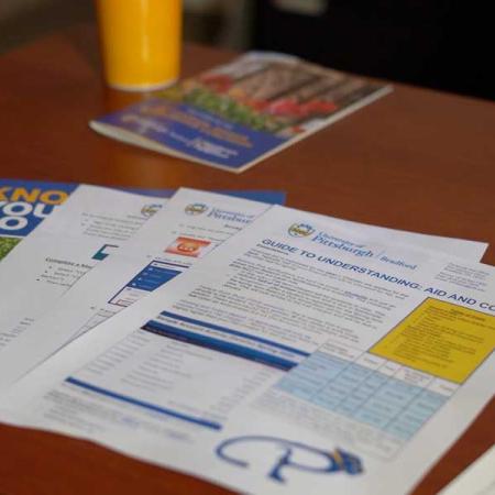 Financial forms spread across a table-top