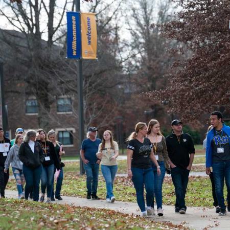 A student taking others on a campus tour