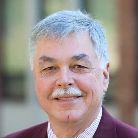 a headshot of previous VP Dean Evans